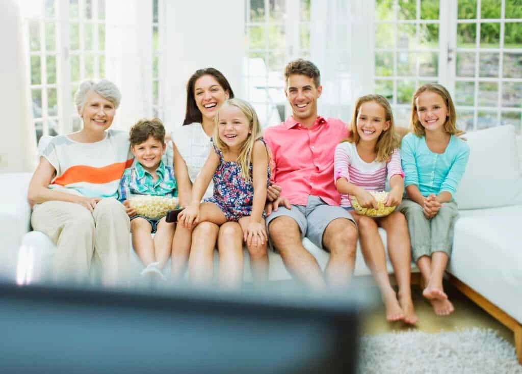 Family watching TV together